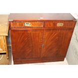 A CAMPAIGN STYLE TWO DRAWER CABINET