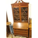 A MAHOGANY BUREAU BOOKCASE WITH ASTRAL GLAZED DOORS AND INLAID SWAN NECK PEDIMENT