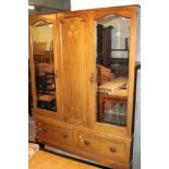 A DOUBLE WARDROBE WITH MIRRORED DOORS AND INLAID CENTRE PANEL