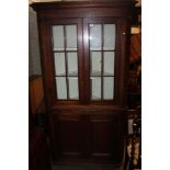 A LARGE MAHOGANY CORNER CUPBOARD