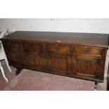 AN OAK LINEN FOLD DRESSER