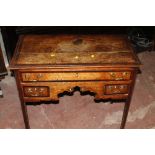 AN ANTIQUE OAK THREE DRAWER HALL TABLE WITH BRASS HANDLES