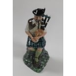 A ROYAL DOULTON FIGURE 'THE PIPER' HN.2907