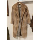 A FULL LENGTH LADIES MUSQUASH FUR COAT SIZE 14