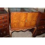 A WALNUT COCKTAIL CABINET