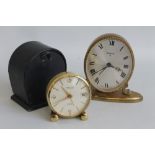 A SMALL VINTAGE "LOOPING, 15 JEWEL" ALARM CLOCK IN CASE, together with a Swiza example (2)