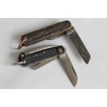 A 1943 BRITISH MILITARY THREE PIECE JACK KNIFE with black plastic grips by W & S Butcher,