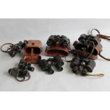 A COLLECTION OF MILITARY BINOCULARS to include examples by 'Kershaw', 'Ross' & 'Bausch & Lomb' (6)