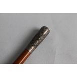 A ROYAL ENGINEER'S PRESENTATION SWAGGER STICK, with hallmarked silver end cap. Die struck badge with