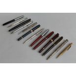 A COLLECTION OF PENS AND MECHANICAL PENCILS to include a hallmarked silver pencil