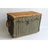 A VINTAGE WICKER HAMPER WITH METAL HASP, with green painted sides. Length 75 cm, Height 53 cm and