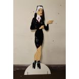 A 2D PAINTED SHEET METAL "NAUGHTY NUN" SIGN / STAND, H 167 cm