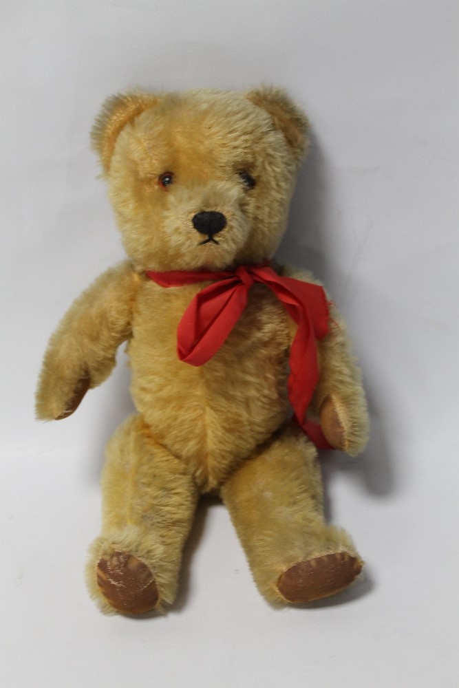 A GOLD PLUSH TEDDY BEAR (POSSIBLY CHAD VALLEY), with jointed body and musical movement
