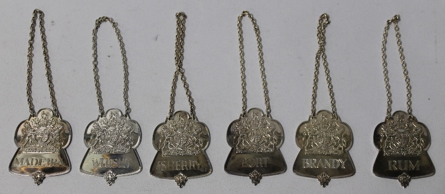 A SET OF SIX THE QUEENS JUBILEE HALLMARKED SILVER DECANTER LABELS, to include port, madeira,