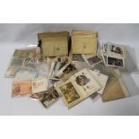 A QUANTITY OF CIGARETTE CARDS IN ALBUMS, together with various postcards and greetings cards and a