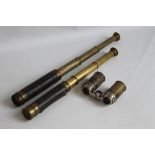 TWO SMALL BRASS TELESCOPES and a set of folding opera glasses in brass tube case (3)