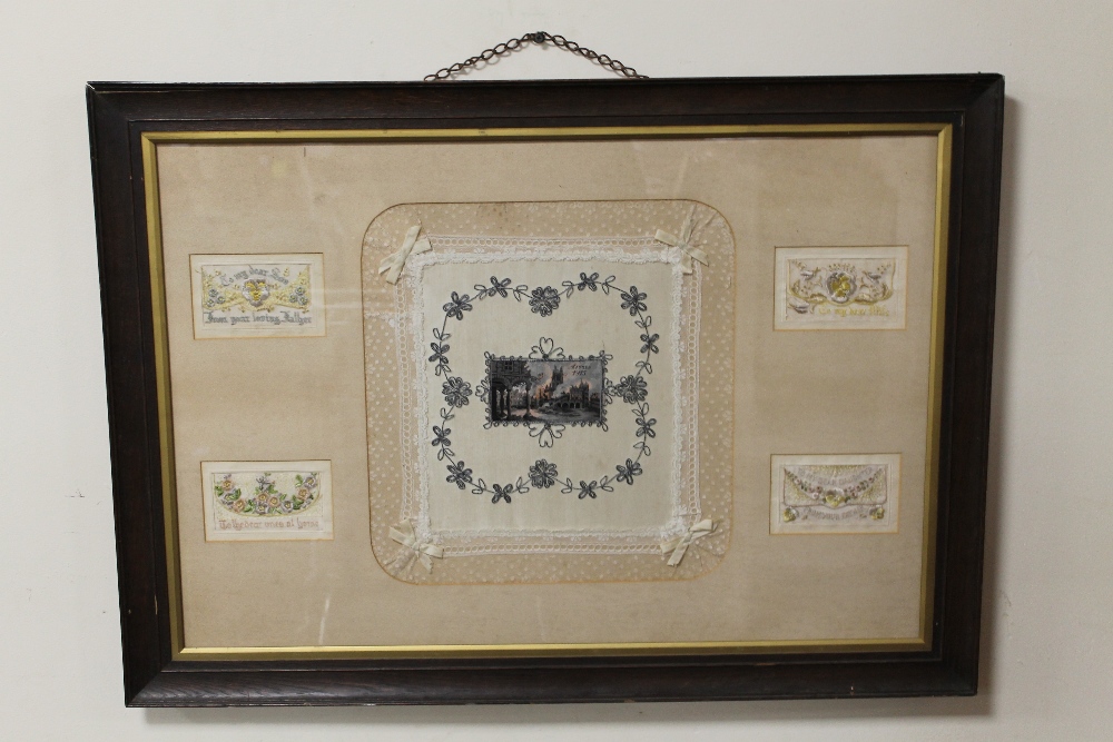 A WWI INTEREST FRAMED SILK HANDKERCHIEF SOUVENIR OF ARRAS, dated 1915, with silk postcards, frame 89