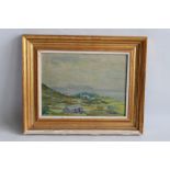 A FRAMED OIL ON BOARD DEPICTING A COASTAL SCENE