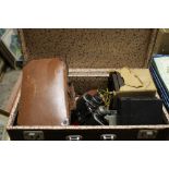 A VINTAGE SUITCASE CONTAINING CAMERAS, BINOCULARS ETC