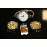 A VINTAGE SILVER CASED WRISTWATCH WITH SILVER STRAP TOGETHER WITH THREE OTHERS (4)