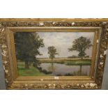 A LARGE FRAMED OIL ON CANVAS OF A FISHERMAN UPON THE RIVERBANK BY J.G.CORBETT (SEE VERSO)