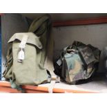 A CLIMBING BACK PACK PLUS A CAMO STORAGE VEST