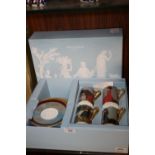 A BOXED SET OF FOUR WEDGWOOD AQUESTRIA CUPS AND SAUCERS