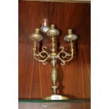 A CONTINENTAL STYLE BRASS THREE BRANCH CANDELABRA