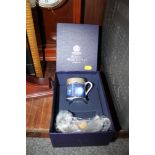 A BOXED ROYAL WORCESTER MILLENNIUM CUP AND SAUCER