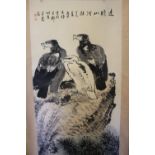 A 20TH CENTURY ORIENTAL SCROLL DEPICTING BIRDS OF PREY ON A ROCKY OUTCROP, character marks to top