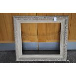 A 20TH CENTURY MODERN BRITISH SCHOOL CARVED WOODEN DECORATIVE FRAME 46 X 53