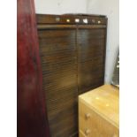 A DARK OAK TAMBOUR FRONTED DOUBLE CABINET, W 83 CM