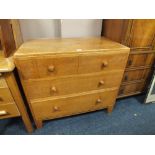 A LIGHT OAK UTILITY STYLE FOUR DRAWER CHEST