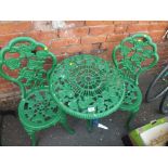 A CIRCULAR CAST GARDEN TABLE WITH FLORAL DETAIL PLUS TWO CHAIRS