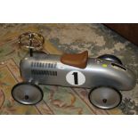 A VINTAGE STYLE MODERN CHILDS PUSH AND RIDE TOY CAR