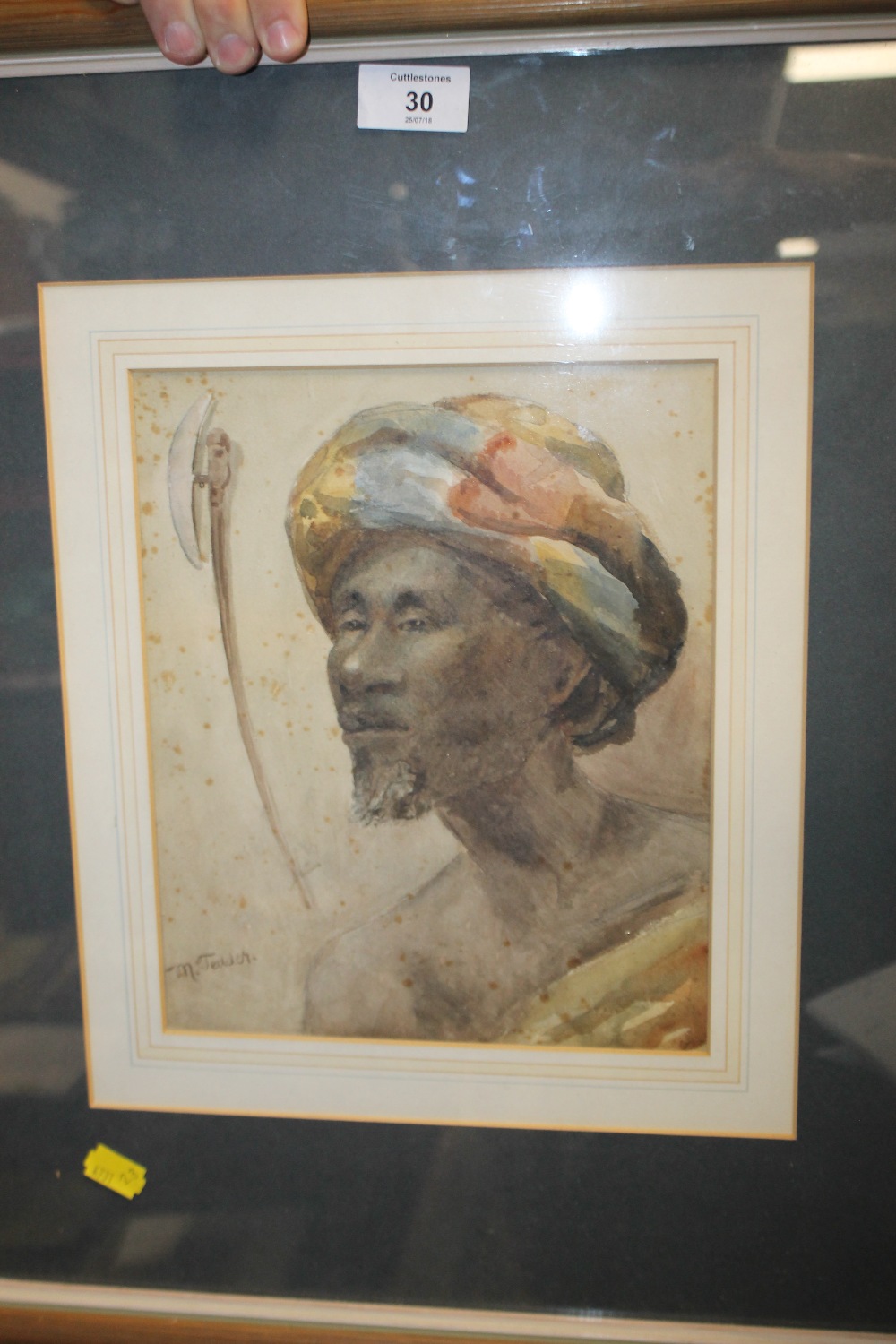 AN INDISTINCTLY SIGN FRAMED AND GLAZED WATERCOLOUR PORTRAIT OF A NORTH AFRICAN GENTLEMAN