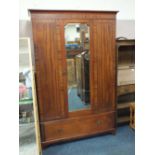 AN EARLY 20TH CENTURY MAHOGANY MIRRORED WARDROBE