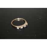 A LADIES 9CT GOLD SEVEN STONE DRESS RING SET WITH BLUE AND CLEAR STONES