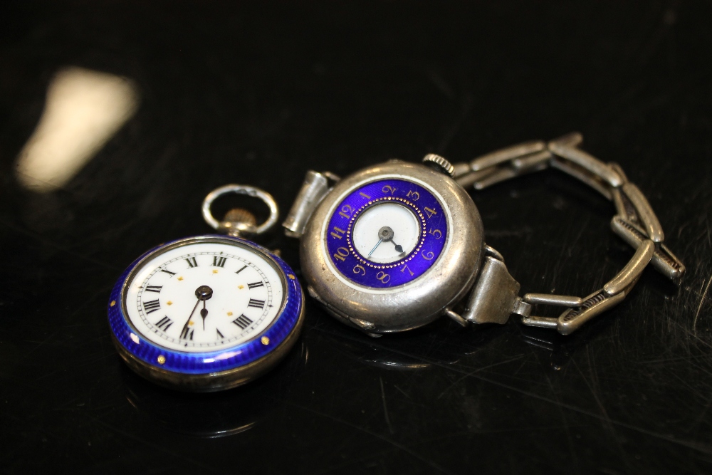 A LADIES VINTAGE SILVER AND ENAMEL WRISTWATCH TOGETHER WITH A SILVER AND ENAMEL FOB WATCH