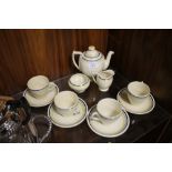 AN ART DECO ROYAL DOULTON FOUR PERSON TEA SET MADE FOR DR SCHOLLS FOOT COMFORT SERVICE