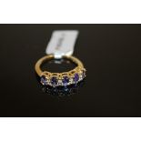 A 10K GOLD TANZANITE SET DRESS RING