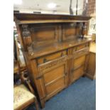 A CARVED OAK COURT CUPBOARD