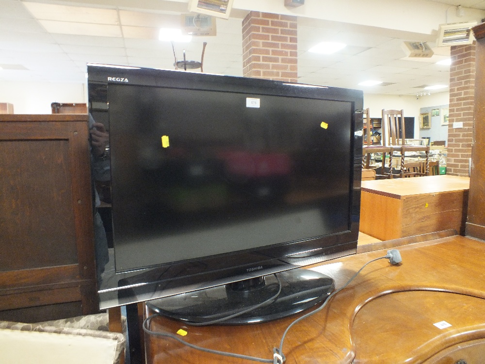 A TOSHIBA 31" FLATSCREEN TV