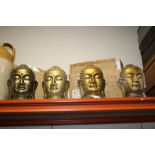 FOUR LARGE BOXED DECORATIVE GILT BUDDHA HEADS