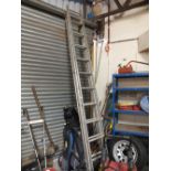 A LARGE SET OF ALUMINUM LADDERS