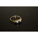 A LADIES HALLMARKED 9CT GOLD FIVE STONE DRESS RING SET WITH BLUE AND CLEAR STONES