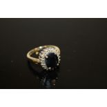 A LARGE 9CT GOLD SAPPHIRE & DIAMOND DRESS RING