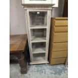 A MODERN GLAZED LIMED OAK STYLE CABINET