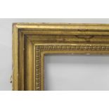 AN ANTIQUE PICTURE FRAME WITH DECORATIVE GILT MOULDING, frame size approx. 74 cm x 56 cm aperture 59