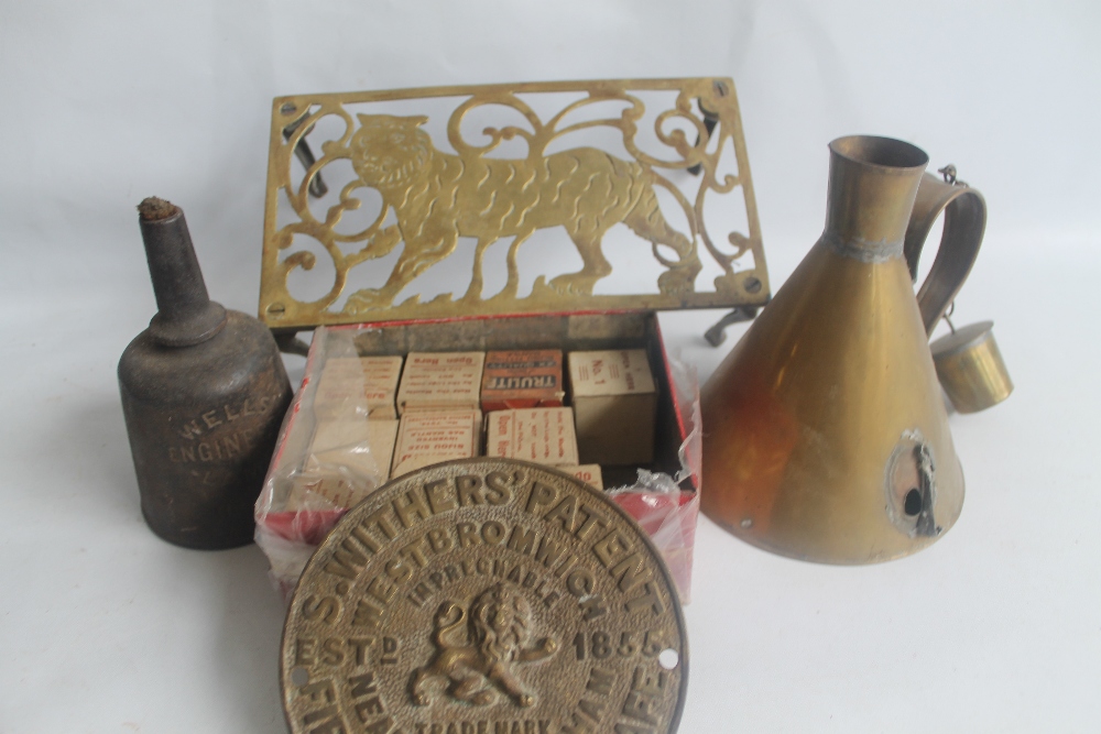 AN S. WITHERS' BRASS SAFE PLATE, A BRASS 'TIGER' TRIVET, A PORTABLE WELLS ENGINEER OIL LAMP NO.4A, a